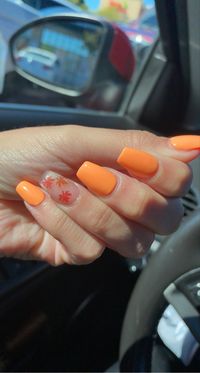 Orange gel nails with fall leaves