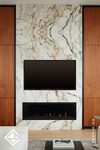 Be amazed by this living room wall's floor-to-ceiling walnut cabinetry with a black surround that graces both sides of the @NeolithOfficial porcelain fireplace wall. The walnut cabinetry features vertical grain-matched slab doors with touch-and-release functionality. Each side boasts pocket doors, with the left serving as a chic coffee bar and the right as a sophisticated cocktail bar...#PocketDoors #LivingRoomWall #FireplaceWall #LuxuryLiving