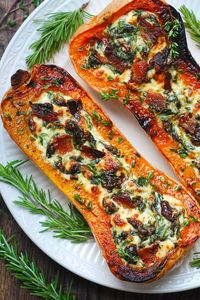 stuffed butternut squash with spinach, bacon, and cheese on a large plate