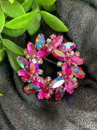 "Absolutely spectacular Large Vintage Signed Sherman Fuchsia Pink Purple Clear Aurora Brooch - a stunning 2 1/4\" large accessory adorned with Swarovski Crystals.  This collectible jewelry piece boasts a captivating blend of fuchsia, pink, and purple hues, complemented by a clear aurora finish. The silver backing adds a touch of elegance to the intricate design. Authentically signed by Sherman, this brooch is a testament to craftsmanship and timeless beauty.  Make a bold statement with this vintage piece, showcasing both artistry and sophistication. Embrace the allure of collectible jewelry and add a touch of glamour to your ensemble! Item is pre-loved, please view photos carefully"