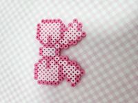 small perler bead bow magnet! highly recommended to only be decor! please keep in mind this is fragile.if pieces aren't stable, they have been glued. (glue is made sure to help with stability. the glue will not be provided.only applied to perler pattern) these are not made for kids. the beads can snap or fall apart. If broken, it can become a choking hazard. please do not give to kids. and for smaller creations, this alone can be a choking hazard. *PLEASE DO NOT GIVE TO YOUNG KIDS!* if item falls apart, I can send instructions for repair if isn't provided. If item comes broken, I can send a new one. (Disclaimer I am still considered a minor and haven't fully perfected these items. most items will not be 100% perfect. Perler beads are hard to get flat and/or the perfect size and shapes so f