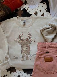 Highland Cow Christmas crewneck.