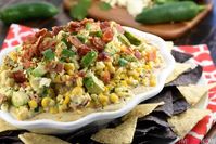 Warm Mexican Street Corn Dip: Cotija Cheese, Avocado, Bacon, Jalapeños, Cilantro, Chipotle Chile Powder, Corn. Creamy smoky heat. | FiveHeartHome.com Recipe