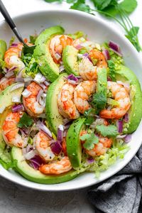 This low-carb Shrimp Avocado Salad is made with only a few simple ingredients with a zesty lime olive oil dressing that adds a fresh flavor!| Shrimp Recipes | Avocado Salad | Seafood Salad |