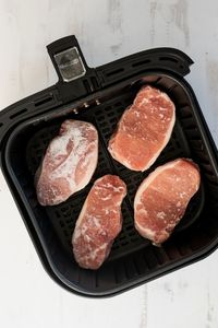 How to make frozen pork chops in the air fryer that are juicy and flavorful! They are an easy dinner idea to make that the whole family will love!