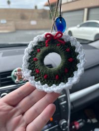 Get festive with these Christmas wreaths that hang from your rearview mirror or can be used as an ornament for your tree! Made with a 2in. wooden ring, acrylic yarn, and hung with jute string, you can choose between a light green or dark green version and flocked or not flocked! I have also included an adjustable wooden bead so you can adjust the length of the wreath once hung. -If you have any questions feel free to send me a message! ️️️