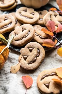 Milk Chocolate Stuffed Jack-O'-Lantern Cookies | halfbakedharvest.com #halloween #thanksgiving #cookies #easyrecipes #chocolate #holidayrecipes #fallrecipes