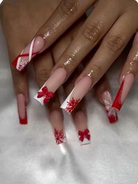 A festive nail design showcases vibrant red and white accents, complete with bows and snowflakes. The playful details capture the holiday spirit perfectly. Elevate your holiday spirit with our festive Christmas nails collection, featuring short press-on nails that are perfect for celebrating in style. Our use of nail wraps and stickers allow for endless creativity, making them an ideal addition to your self-care box or care package for her. Whether you're looking for a thoughtful 8th anniversary gift or a unique Scorpio gift, these stylish nail accessories are sure to impress. They also make a delightful surprise for a 16th birthday gift or as a special treat in an advent calendar gift. With our short square nails, getting ready for the holidays has never been easier or more fun. Treat you