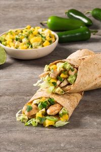 Looking for the perfect weeknight dinner? We've got you covered with our chili-lime chicken wraps, with mango-avocado salsa. 😋🥑 🍗 🌶️