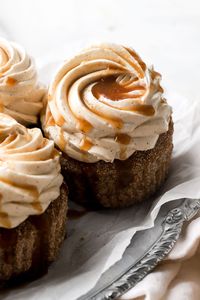 These apple cider cupcakes are made with apple cider, frosted with apple cider buttercream and a drizzle of apple cider caramel sauce.  