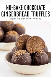 Chocolate gingerbread truffles are an easy no-bake dessert for the holidays! The recipe is vegan, gluten-free, and made with healthy ingredients like almonds, oats, and medjool dates. The soft and chewy gingerbread cookie dough is coated in rich chocolate. They are perfect for Christmas, gifting, and holiday parties! #truffles #gingerbread #gingerbreadcookies #nobakedesserts #energyballs #holidaydesserts #christmasdesserts #christmasrecipes #holidayrecipe