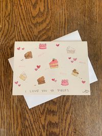 "This sweet card is perfect for the loved one in your life! Great for Valentine's Day, an anniversary or just because!  It features a hand drawn pen and watercolor design.  The card is 5\" by 7\" and is blank inside with a graphic in the bottom right corner.  Comes with a white envelope and clear plastic sleeve to protect the card.  Note: Each card is handmade and unique, there may be differences in separate cards of the same design.  Paper: 140 lb. / 300 gsm high quality cold press watercolor paper Size: 5\" by 7\""