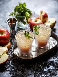 Apple Cider Rum Coolers are the perfect summer meets fall cocktail. Spicy rum mixed with honeycrisp apples and topped ginger beer is a refreshing combo!