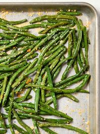 A baking sheet with roasted green beans