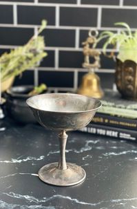 Pedestal Silver Plated Chalice, Altar Offering Dish, Lovely vintage decorative witch tool. Wide mouth chalice or dish, beautiful clean design.  Perfect Altar dish, candle holder,  and for displaying a collection of rocks or crystals.  🕸️ Vintage items are at least 20 years old. Each item has lived a previous life and might have some light wear and manufacturing imperfections. This vintage item show signs of usage wear and has patina marks.  Items are shown as they will be sent, I only wipe items of surface dirt, I do not buff, polish, or use any cleaning agents on these pieces.  🕸️FREE DOMESTIC SHIPPING Silver Plated Stamped De Uberti Italy on the bottom approx. 4.25 inch diameter, 4.5 inch high, 1.5 inch deep PLEASE READ- Vintage Items are sold "as-is". Please look at the pictures, vide