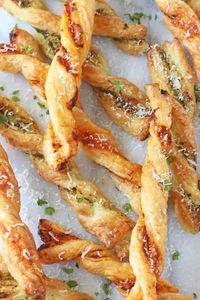 These Pesto Parmesan Pastry Straws make a super easy snack or party appetizer for the festive season! ​ ​A baking tray full of these golden brown cheese twists are super easy to make but will have the whole family thinking you have spent hours slaving away in the kitchen!