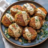 Discover how to make crispy baked falafel with tahini sauce. This healthy and flavorful recipe is perfect for meal prep or as a tasty snack!