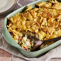 This green chile rotisserie chicken casserole features tender rotisserie chicken, with lots of tender vegetables. A crunchy topping of crushed tortilla chips finishes off this comforting, Southwestern-inspired casserole.