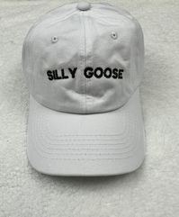 The words silly goose embroidered on a unstructured dad baseball hat.  Customize you hat with your choice of color. Primary Color is the hat color.  Item Details: 100% cotton twill Pigment dyed Garment washed Low Profile 6 panel Brass buckle or Velcro adjustable strap One size fits most No returns or exchanges on customized items. Please contact me at any time for concerns about your purchase.