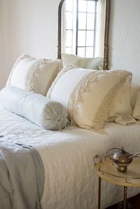 Linen King Pillowcases in Parchment, Frida Deluxe Shams in Parchment, Austin Quilted King Coverlet in Winter White, Paloma Bolster in Sterling, Delphine Personal Comforter in Sterling