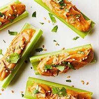 Asian Ants-on-a-Log: Inspired by Thai peanut sauce (and everyone's favorite childhood snack), these celery sticks are a tasty and nutritious afternoon snack. The recipe easily multiplies to serve at a party.