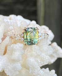 Ring Details  Narya ring cost AUD 6960   Main Stone: Natural Green Sapphire (Unheated) Color: Mint Green Carat weight: 3.06ct Dimensions: 8.44 x 7.01 x 525mm Clarity : VS-VVS Country of Origin : Madagascar Setting : Diamond Cluster Metal: 14K Rose Gold Accent Stones: Natural White Diamonds 0.30ct Total (VS-VVS/ Color G)   for more information pls visit the link , Thank you !!