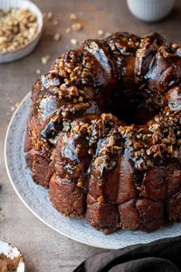 Vegan banana monkey bread - this delicious pull-apart bread is sweet, sticky and utterly more-ish! Soft, banana flavoured yeast dough balls are coated in butter and cinnamon sugar and layered with chopped walnuts to make an impressive, and addictive, brunch recipe.