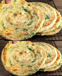 Imagine biting into a warm, crispy flatbread, freshly pan-fried and brimming with the robust flavors of green onions and spinach. This no-oven flatbread encapsulates the joy of simple, hearty cooking, ... Read more