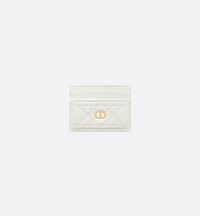 The Dior Caro Freesia card holder presents an elegant and practical style. Crafted in latte supple calfskin with Cannage stitching, it is embellished with the CD signature on the front. Featuring five card slots, the refined accessory will fit anywhere and can be paired with other Dior Caro creations..