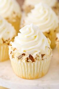 These Almond Amaretto Cupcakes have a moist almond cupcake, almond frosting and a fluffy white chocolate amaretto center!