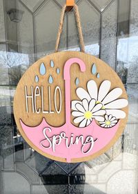 This Hello Spring door sign is a perfect addition to any front door!  This Sign is 15" round and is made with 1/4" wood.  It also has 3D pieces including the wording. These are all made from reclaimed wood and each piece is unique. It is made to appear old, antique, or vintage. It would be a great addition to any rustic, country, primitive, or farmhouse decor. This item is solid wood and handmade to order. Please be aware that there will occasionally be slight variations in the wood, texture, color, and distressing pattern, as no two pieces are exactly the same due to the handcrafted nature. Each one is a handmade one-of-a-kind piece.  ADDITIONAL INFO: * Measurements are approximate and may vary slightly. * All wood is handpicked by us. There may be natural imperfections in the wood. We do