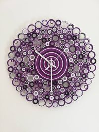 Wall Clock, Quilling Art, 1st Anniversary Gift, Paper Clock, Paper Art, Unique Wall Art, Home Decor Wall, Purple White and Black Wall Clock Welcome to my shop! This wall clock is made of paper, glue and lots of patience! This one in picture for example, was created whit Purple (predominant) White and Black cards. It is an unique decoration for your home or office but also as a housewarming gift or for the first wedding anniversary (Paper Wedding) DOES THE CLOCK MAKE NOISE? Absolutely not! With a minimalist style, it is a silent wall clock and is equipped with a hook (works with AA battery), the hands run silently. It is a paper clock but it seems to be made of wood for its resistance (it is light but well glued) The hands can be black, red, silver, gold or white. For anyone who loves handm