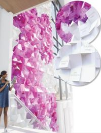 How do you create an evolving work of art that commemorates current and future donors? This was the challenge for our team while creating the Legacy Wall at Kanawha County Public Library in Charleston, West Virginia.

The wall is made up of juxtaposed blocks, alternating plain white with etched names or printed with the fuchsia state flower, the rhododendron. Each block is easily replaceable, resulting in the library having the flexibility to continuously add donor names to the wall.