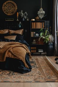 Lose yourself in the ethereal beauty of ebony in a boho bedroom hideaway where layers of texture and soft lighting create a cocoon of comfort and serenity, enveloping you in its soothing embrace.—click to get inspired!