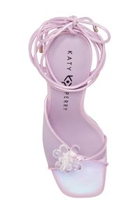 A beaded flower tops the asymmetric vamp of an enticing sandal with slim ties that slink up and around your ankle a few times. 3 1/2" heel Synthetic upper/synthetic and textile upper/synthetic sole Imported