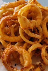 Looking for the best side dishes? Try cooking these homemade onion rings with this fantastic onion ring batter. You will love cooking this quick and easy side dish with dinner, a cookout, or potluck. #dinnersidedish #sidedishes #sidedishideas #sidedishrecipes #sides