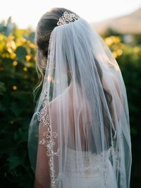 Reminiscent of roses, this bridal hair comb is designed in matte gold flowers with shiny gold edges and a few glass rhinestones. A long toothed style comb for wearing atop your veil or as a side piece. It is 4.25 inches long and 1.75 inches high.