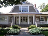 Beautiful house! Who is the manufacturer of the entry door? And is it a wood or metal door?