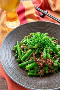 This easy Green Bean Stir Fry recipe is loaded with tender vibrant green beans and ground pork seasoned with a delicious chili garlic black bean sauce. #sichuan #chinesefood #easyrecipe #easydinner #greenbeans #pork #stirfry