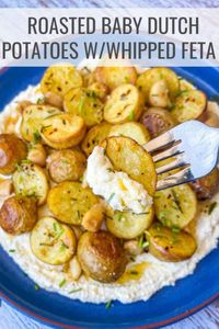 The perfect side dish for any seafood meal - crispy roasted potatoes and roasted garlic with herbs, served over a bed of creamy whipped feta. This one will keep everyone coming back for seconds. Pin it to your favorite recipe board today. 