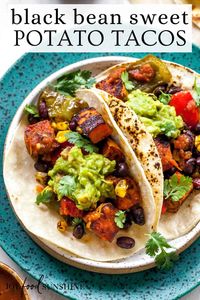 These healthy black bean sweet potato tacos are the best vegetarian tacos ever. Sweet potatoes and vegetables are perfectly spiced and roasted, then tossed with a honey, lime cilantro mixture for the most flavorful and delicious tacos. Taco night isn't complete without this sweet potato taco recipe!