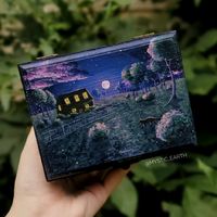 A dreamy nightime scene with a farmhouse with a cat walking up to it. Hand painted with acrylic, stained black siding. available on my site or linked below! 

Mystic earth by Annabell Larsh 

#witchy #witchart #painting #illustration #acrylicpainting #cottage #fairy #fairytail #handmade #craft #landscape #nature #smallbusiness #jewelrybox #storage #decor #homeinspo