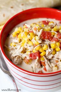 A hearty soup filled with chicken, corn and tomatoes.