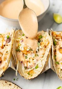 These irresistible fish tacos are bright, perfectly seasoned, and have the best sauce ever! Make this straightforward taco recipe for a totally delicious family meal.