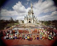 October 1, 1971: Walt Disney World opens in Orlando, Florida  Photo: Group portrait of entire Walt Disney World staff standing in front of Cinderella Castle prior to grand opening of amusement park. Yale Joel/Time Life Pictures/Getty