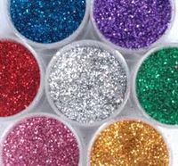 Edible Glitter!! 1/4 sugar, 1/2 teaspoon of food coloring, baking sheet and 10 mins in oven