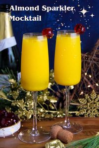 A non alcoholic treat, perfect for Festive celebrations. Inspired by a mimosa, this non-alcoholic treat has orange juice with a hint of almond and a touch of sparkle. Try it with Christmas Breakfast or to bring in the New Year.