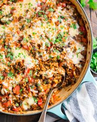 This easy, healthy Stuffed Pepper Casserole takes classic stuffed pepper ingredients like rice, ground turkey (or ground beef), tomato, and cheese and turns them into a healthy, all-in-one meal! Everything cooks in one skillet even the rice for easy clean up! #stuffedpeppers #lowcarb #onepanmeals #healthydinners #wellplated