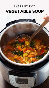 Quick, easy, nourishing and delicious Instant Pot Vegetable Soup is perfect year round. Cauliflower, asparagus, bell pepper, zucchini, carrot, celery, kale, and chickpeas make for a flavor explosion! #instantpot #vegetablesoup #soup #easyrecipes #healthy