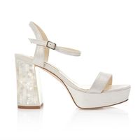 Soft shimmering ivory suede platform sandal with mother of pearl block midi heels.